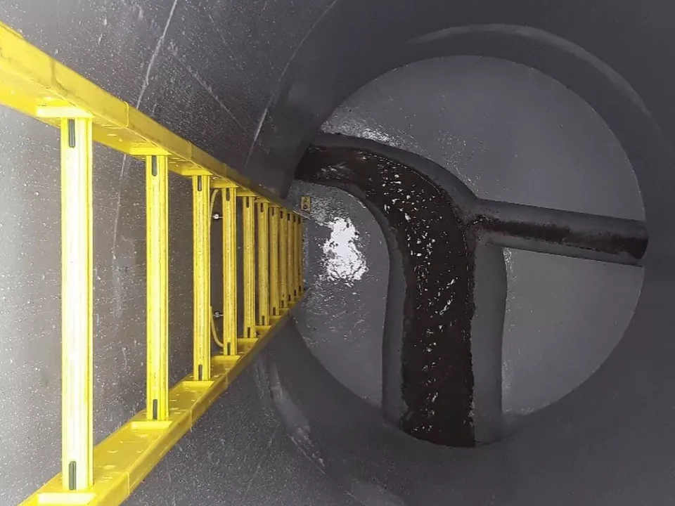 Looking down a coated manhole with ladder
