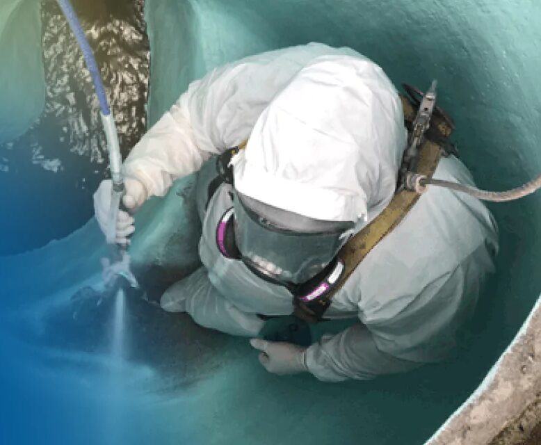 Spraying polyurea into a manhole
