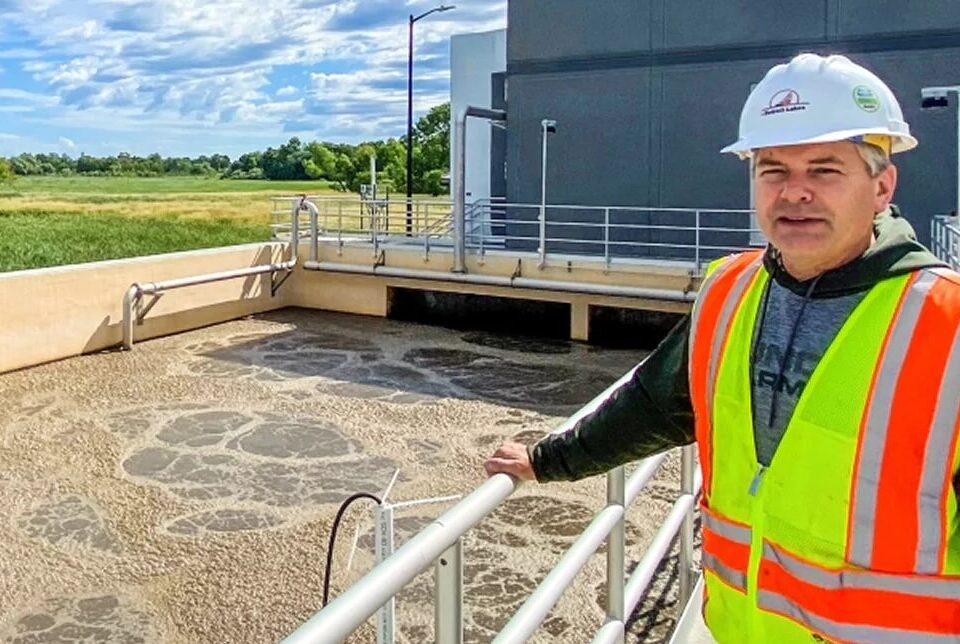 Engineer reviewing an aeration basin at a wastewater treatment plant
