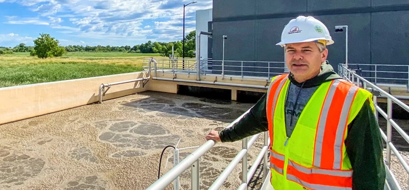 Engineer reviewing an aeration basin at a wastewater treatment plant