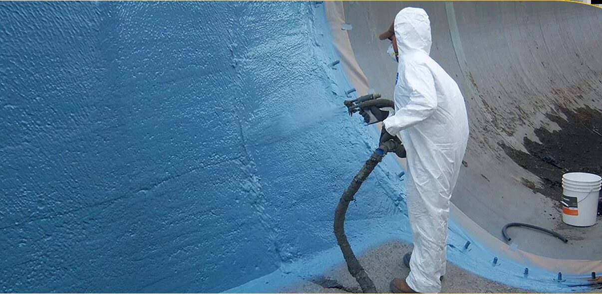 Applicator in protective suit spraying polyurea on a tank wall